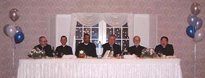 Attending priests at head table