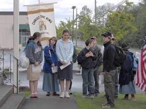 younger pilgrims with banner