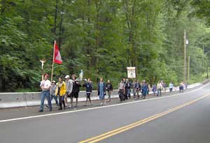 pilgrim walking along road