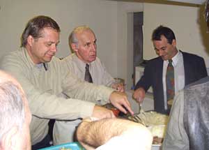 three men in kitchen