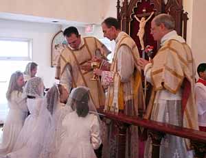 Confirmands receive Holy Communion