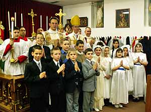 confirmed children with bishop and servers