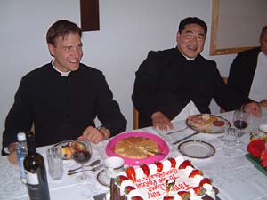 Frs. May and Sulzen with cake