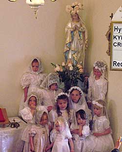 Little girls in white with  Our Lady