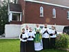 Priests and servers outside of Sherbrooke parish