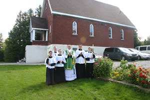 Priests and servers outside of Sherbrooke parish