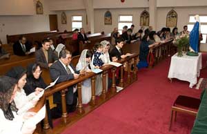 Parishioners kneeling at altar rail