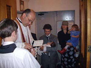 Fr Boulet reads prayers of Baptism