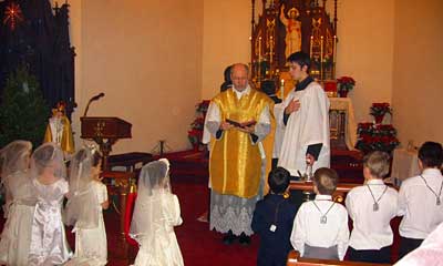 Father enrolls the children in the brown scapular