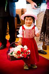 little girl with basket of flowers