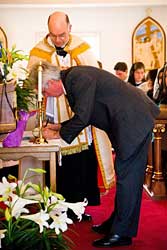 Parishioner signs his consecration at Our Lady's altar