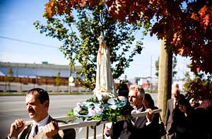 Pilgrim Virgin statue borne in procession