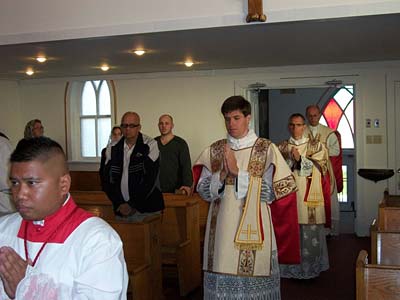 Celebrantants enter the church