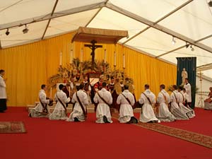 ordinands kneeling around altar