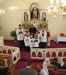 Fr. Mery with servers at Canadian Martyrs' Chruch