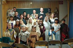 children in saints costumes