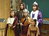 children in saints costumes