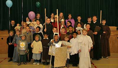 children in saints' costumes