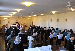 Attendance at Sunday High Mass in the school chapel 