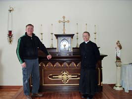 Fr Scott and Mr Slinko infront of new altar