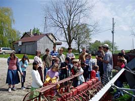 children around farm equipment