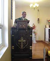 Father Scott in pulpit