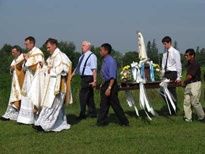 three priests at head of procession