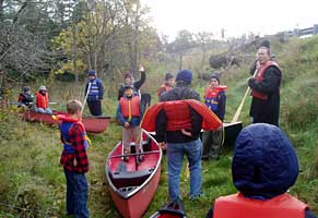 Fr Scott instructs canoeists