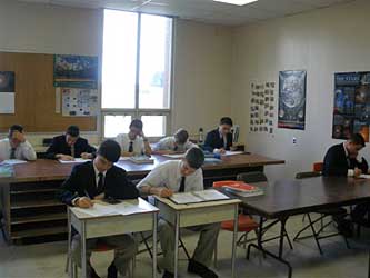 High school boys at work at their desks