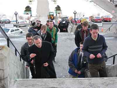 ascending the steps to the Oratory on their knees