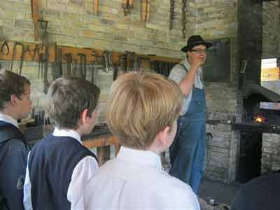 Students listening to the blacksmith