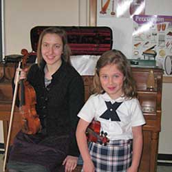 violin student with teacher