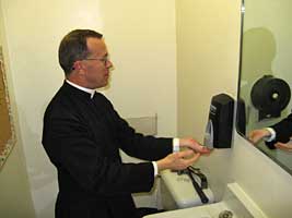 Fr Scott washing hands