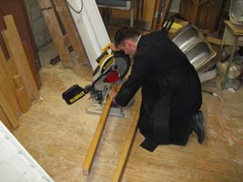 priest doing woodwork