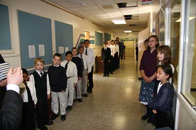 Children lined up in the hall