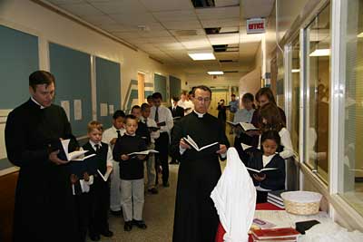 priests and students with song books